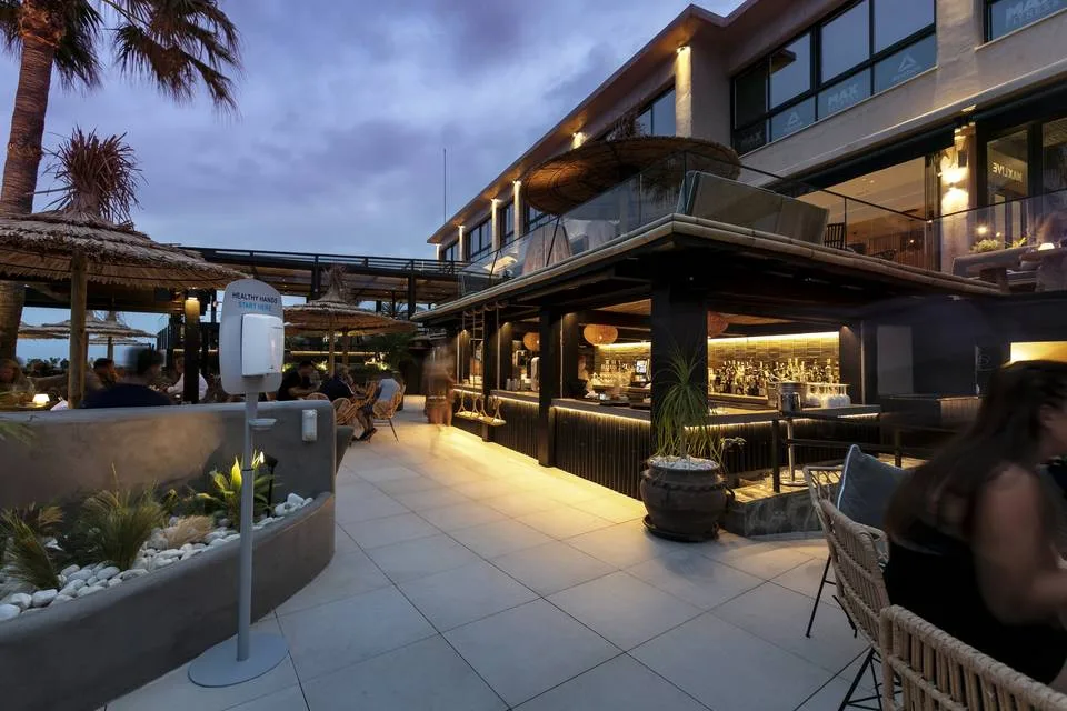 The outdoor bar at Max Beach in the evening