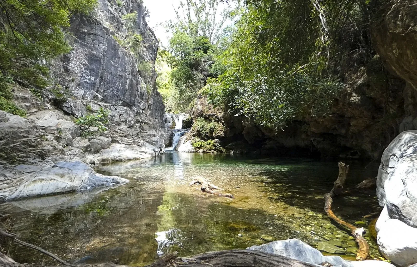 A crystal-clear pool below the little waterfall at Barranco Blanco